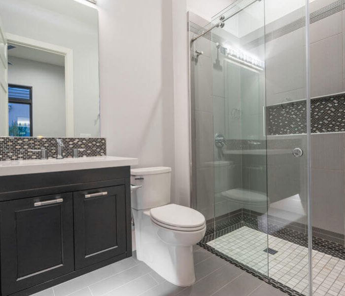 modern style bathroom vanity in black with white quartz countertop