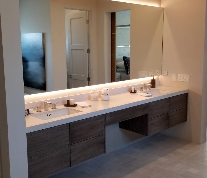 modern style bathroom vanity in dark wood stain with white quartz countertop