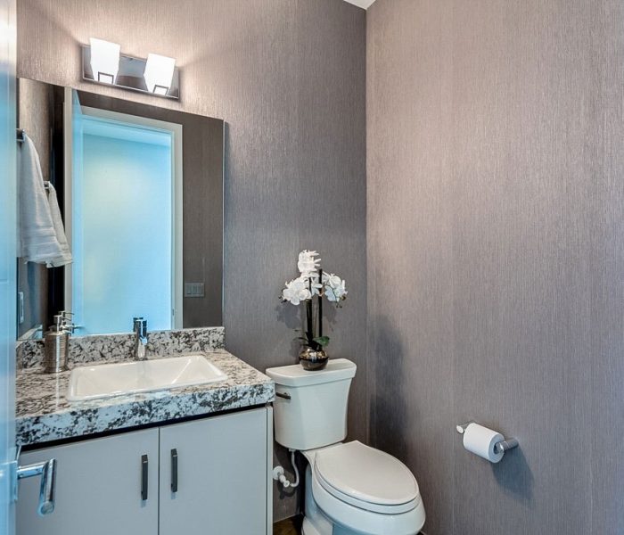 modern style bathroom vanity in white with stone quartz countertop
