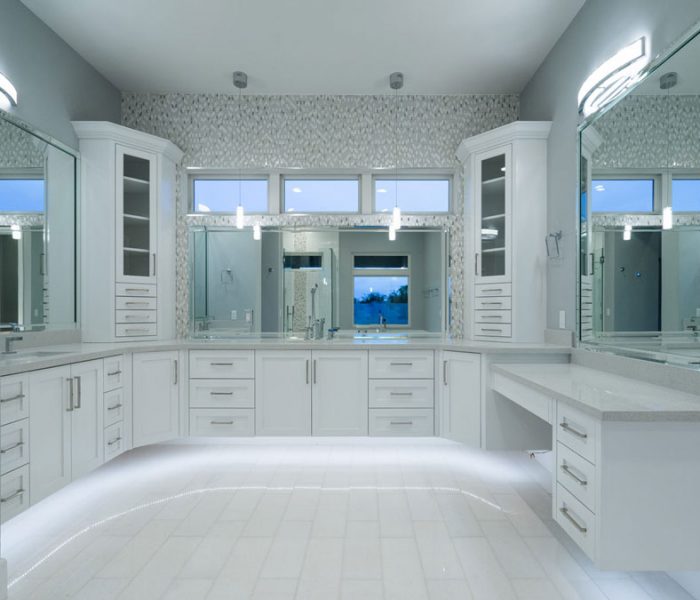 transitional style bathroom vanity and hutches in white with gray countertops