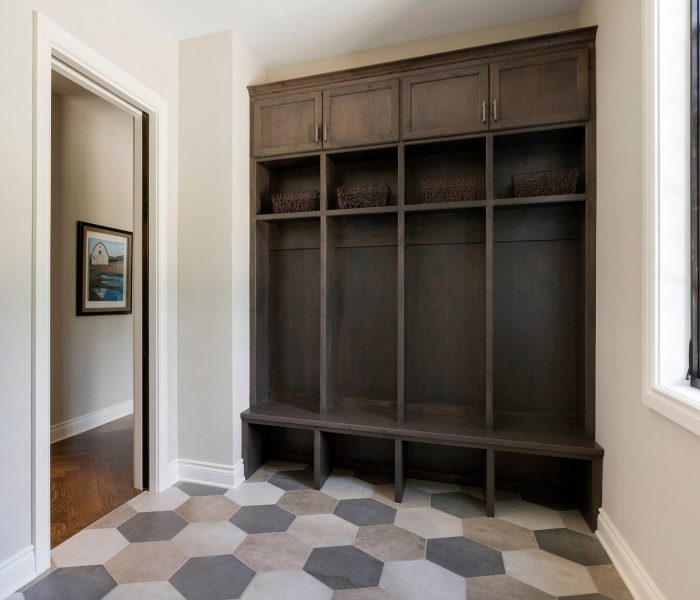 traditional mudroom cabinetry in dark stain