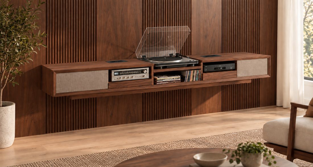 The walnut media console hung on a wood slat wall, with a turntable, receiver, records and disc player.